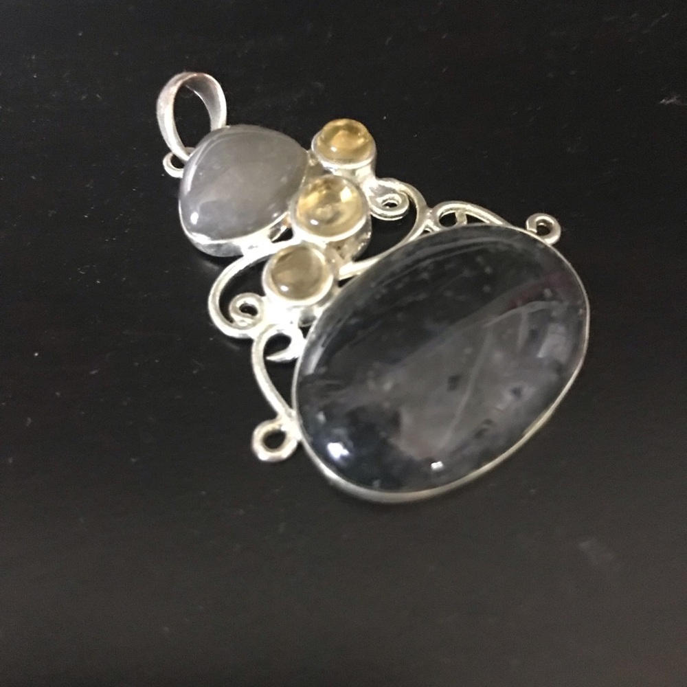 Sterling silver pendant w/ onyx and citrine stone.